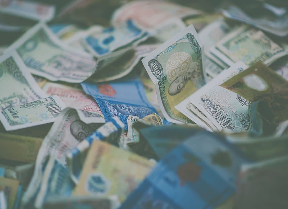 Banknotes from several countries laid out together